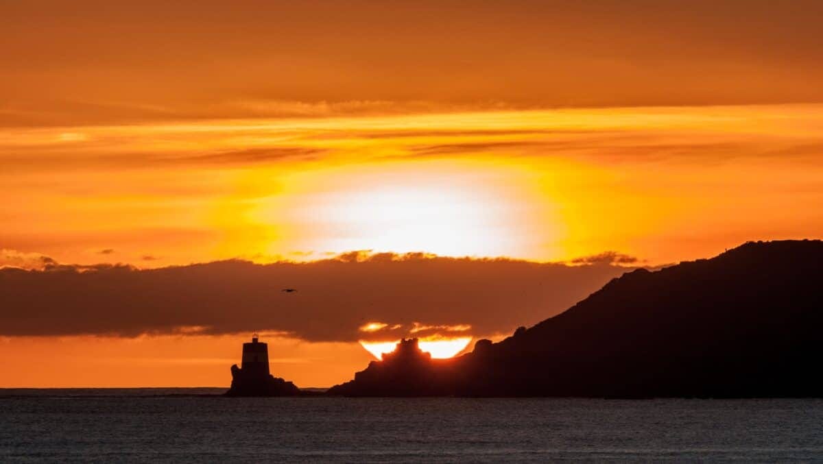 Sunset behind Noirmont Tower, from West Park, St. Helier