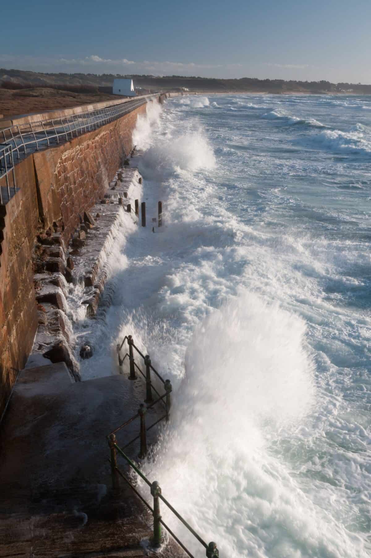 High tide at the sea wall, L'Ouzière Slip, St. Ouen's Bay