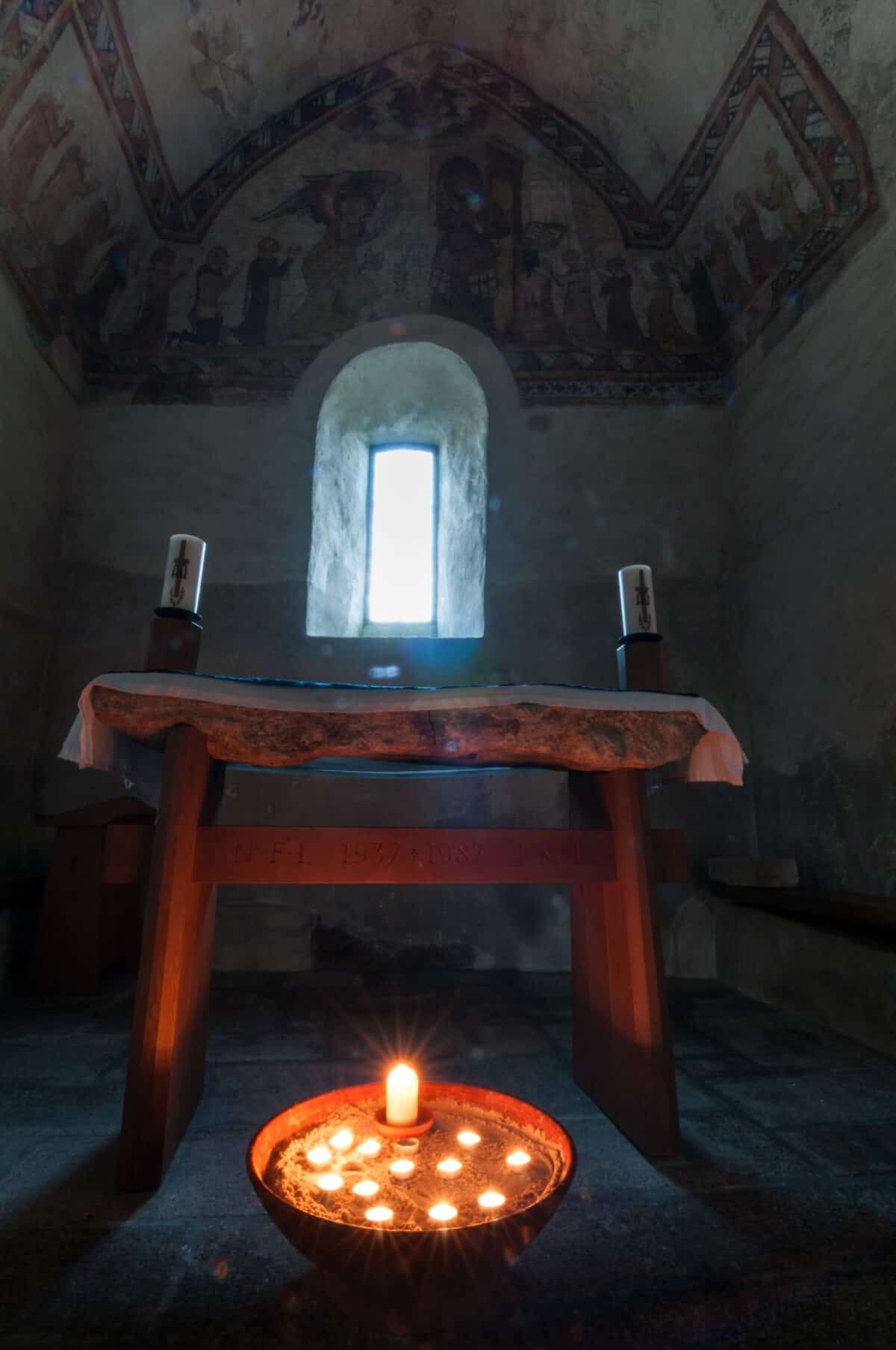 Candles in the old Fisherman's Chapel, St. Brelade's Church