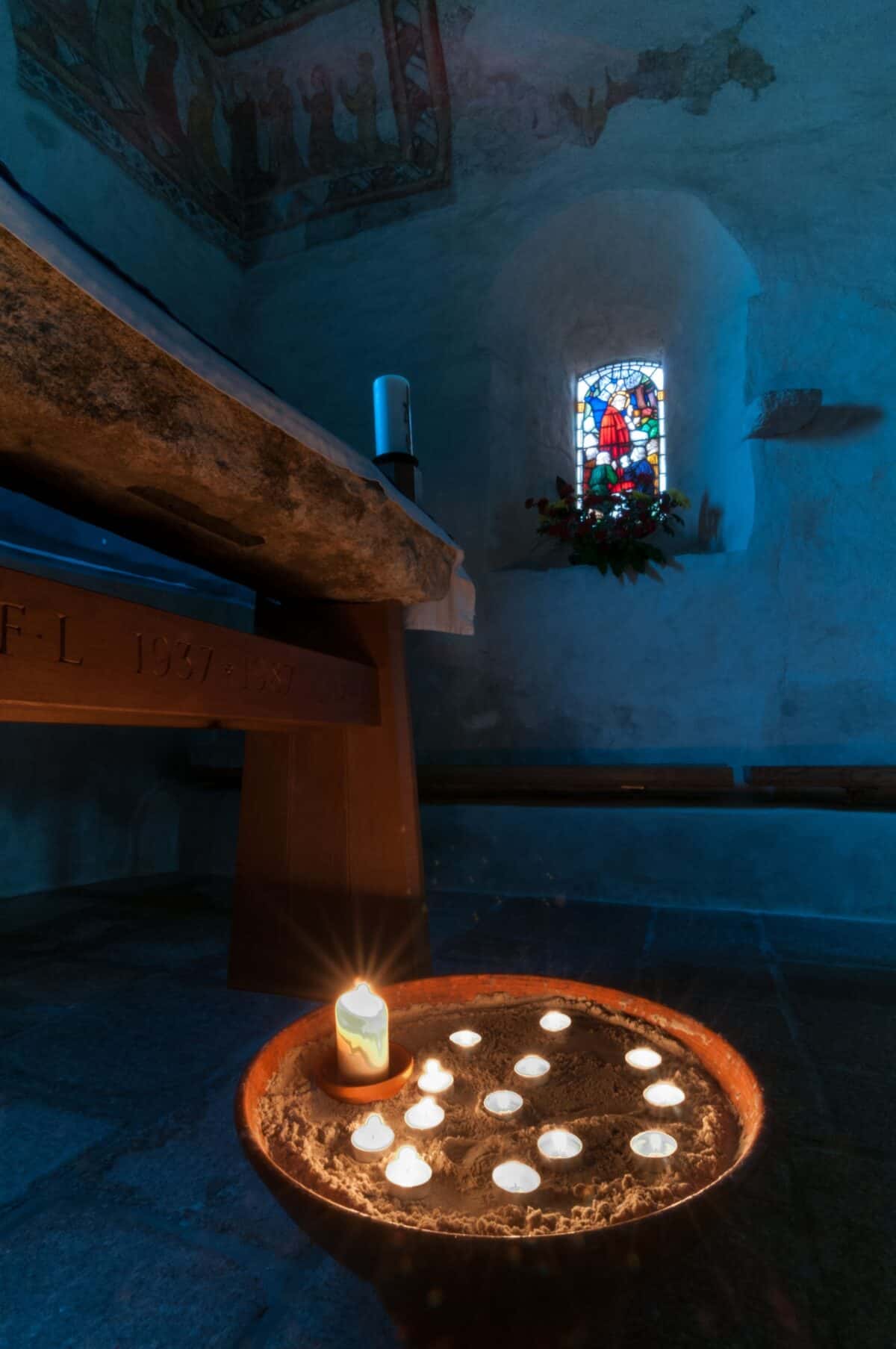 Candles in the old Fisherman's Chapel, St. Brelade's Church