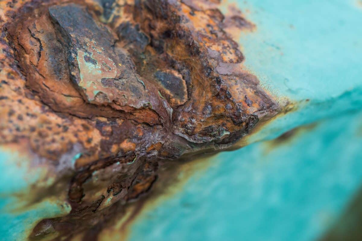 Coloured and textured rust on a barrier gate at Les Landes