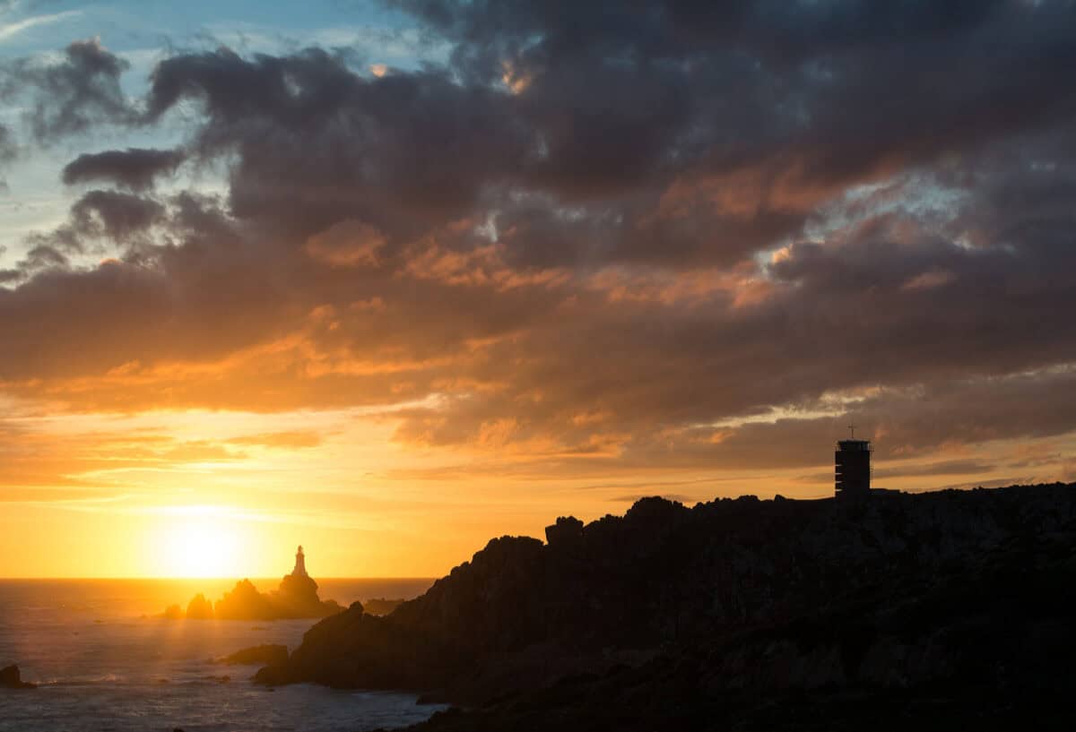 Corbière Lighthouse and silhouetted cliffs and the Radio Tower