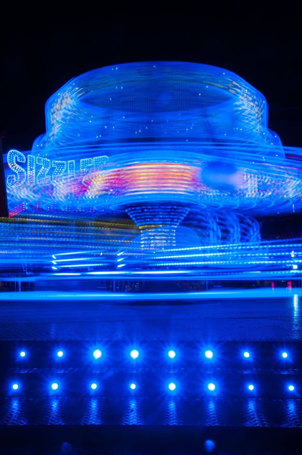Fairground ride at Battle of Flowers Funfair, People's Park