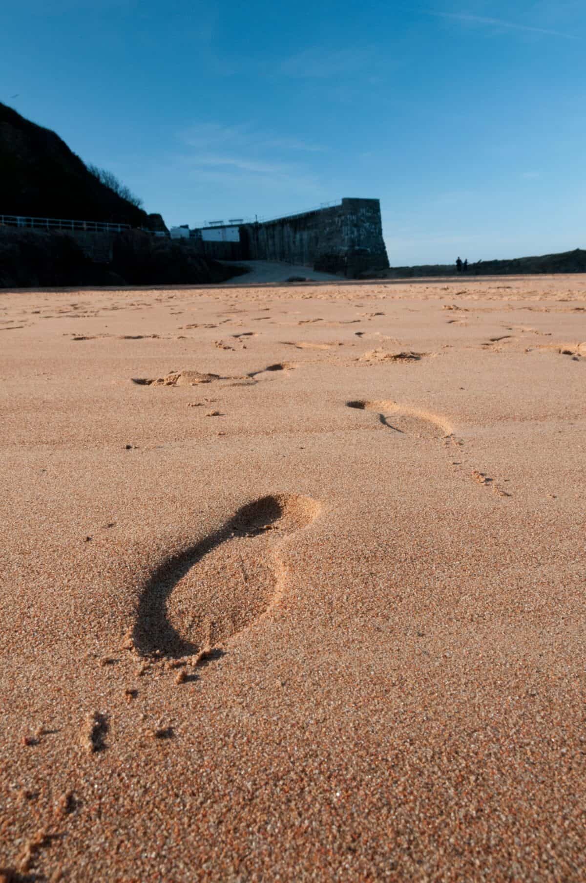 Footsteps on the beach at Grève De Lecq, St. Ouen, Jersey