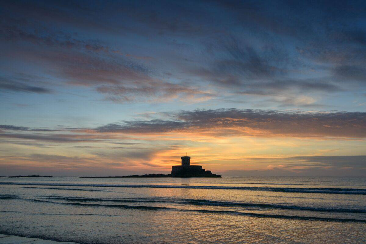 La Rocco Tower sunset reflecting on the waves, El Tico