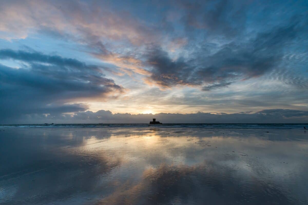 La Rocco Tower sunset on wet sand, El Tico, St. Peter, Jersey
