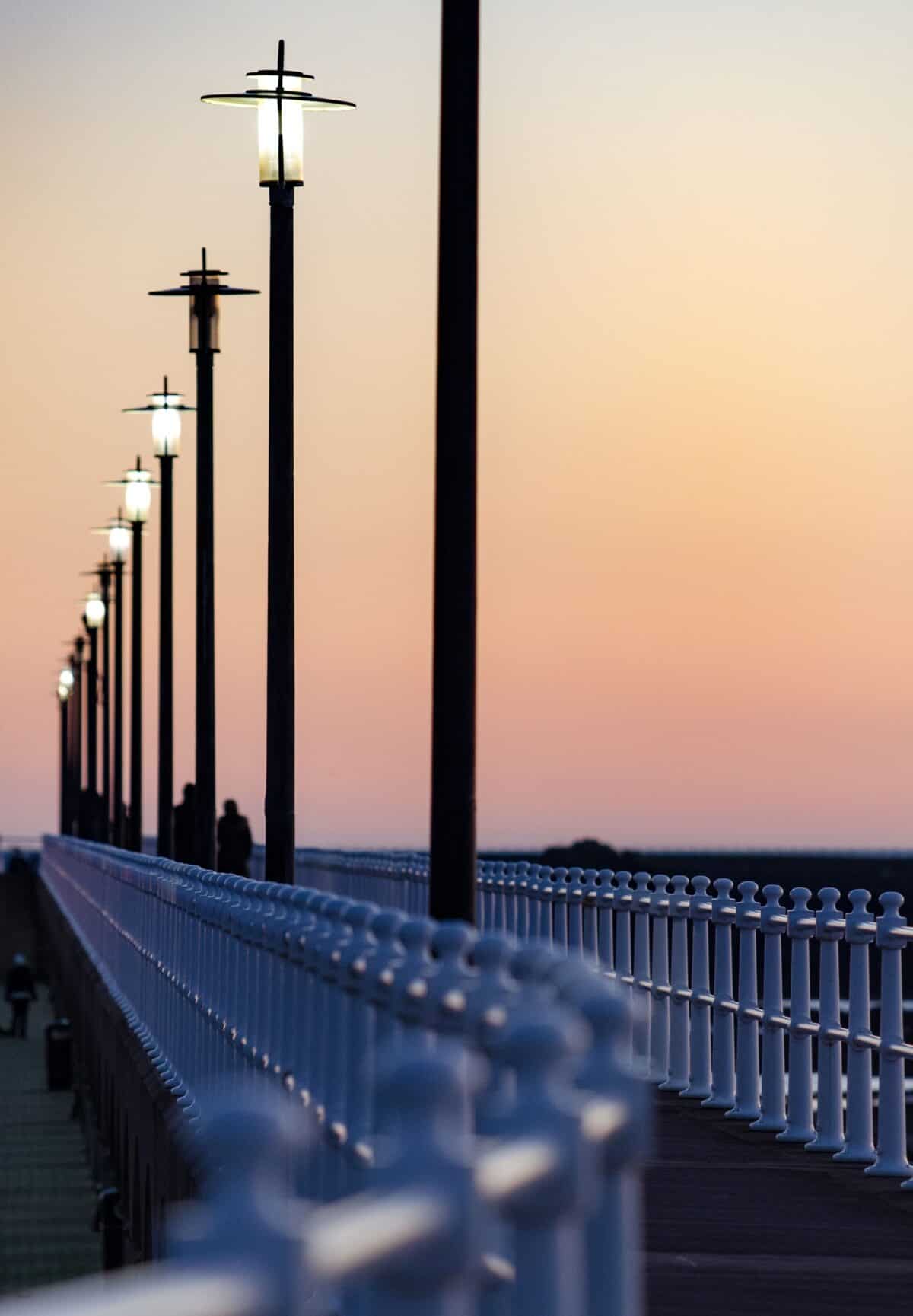 Lamps and railings at St. Helier Marina at sunset, St. Helier