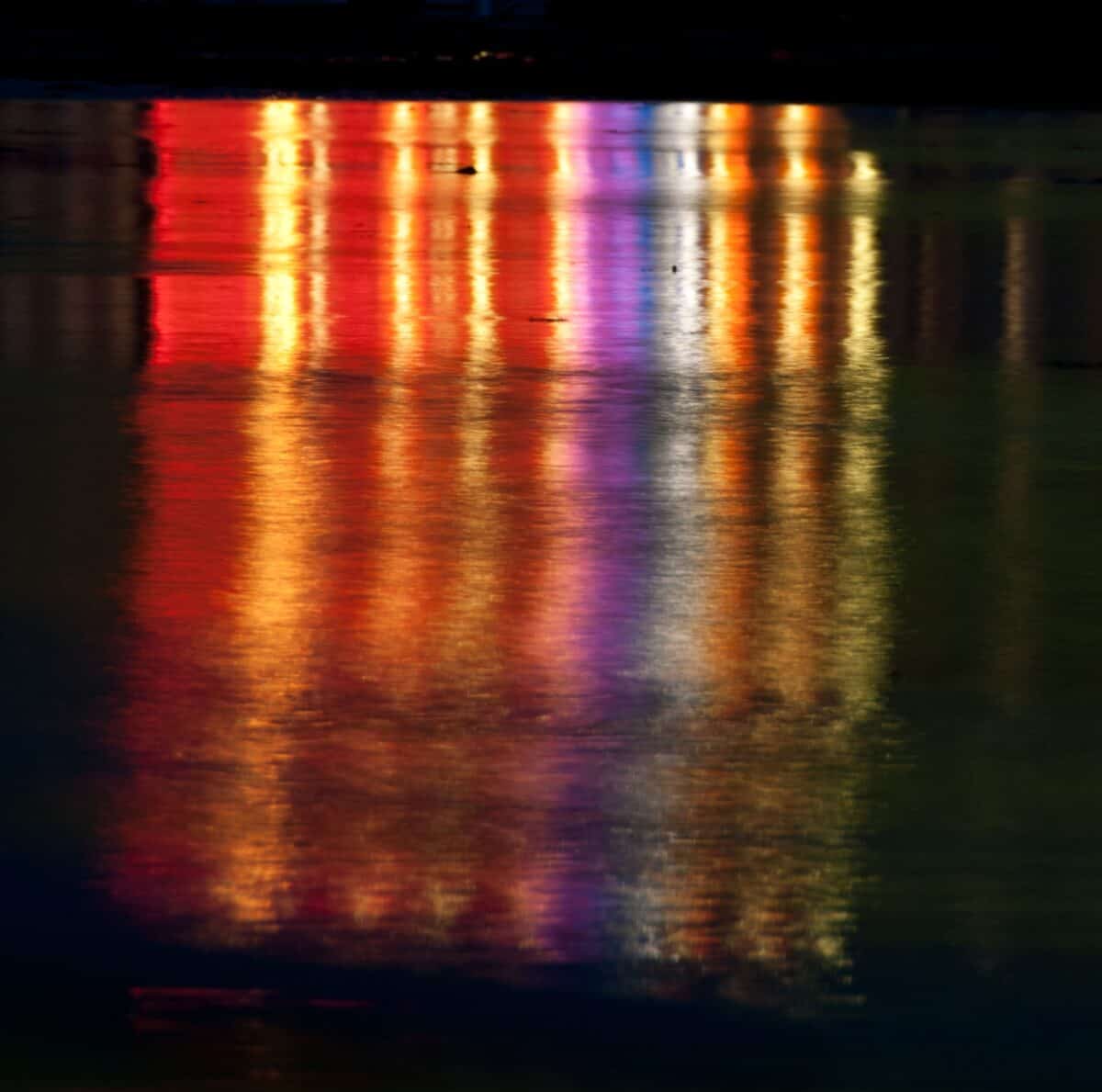 Lights on Gorey Pier reflected in the sand, Gorey, St. Martin