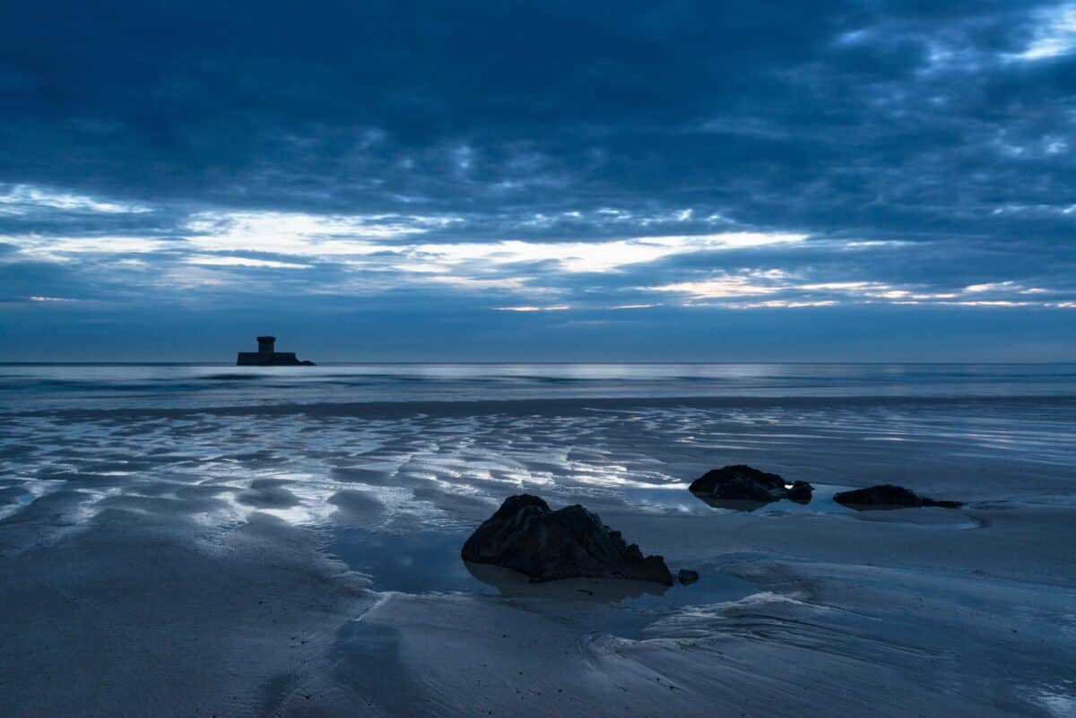 Puddles after sunset at La Rocco Tower, Le Braye, St. Ouen's Bay