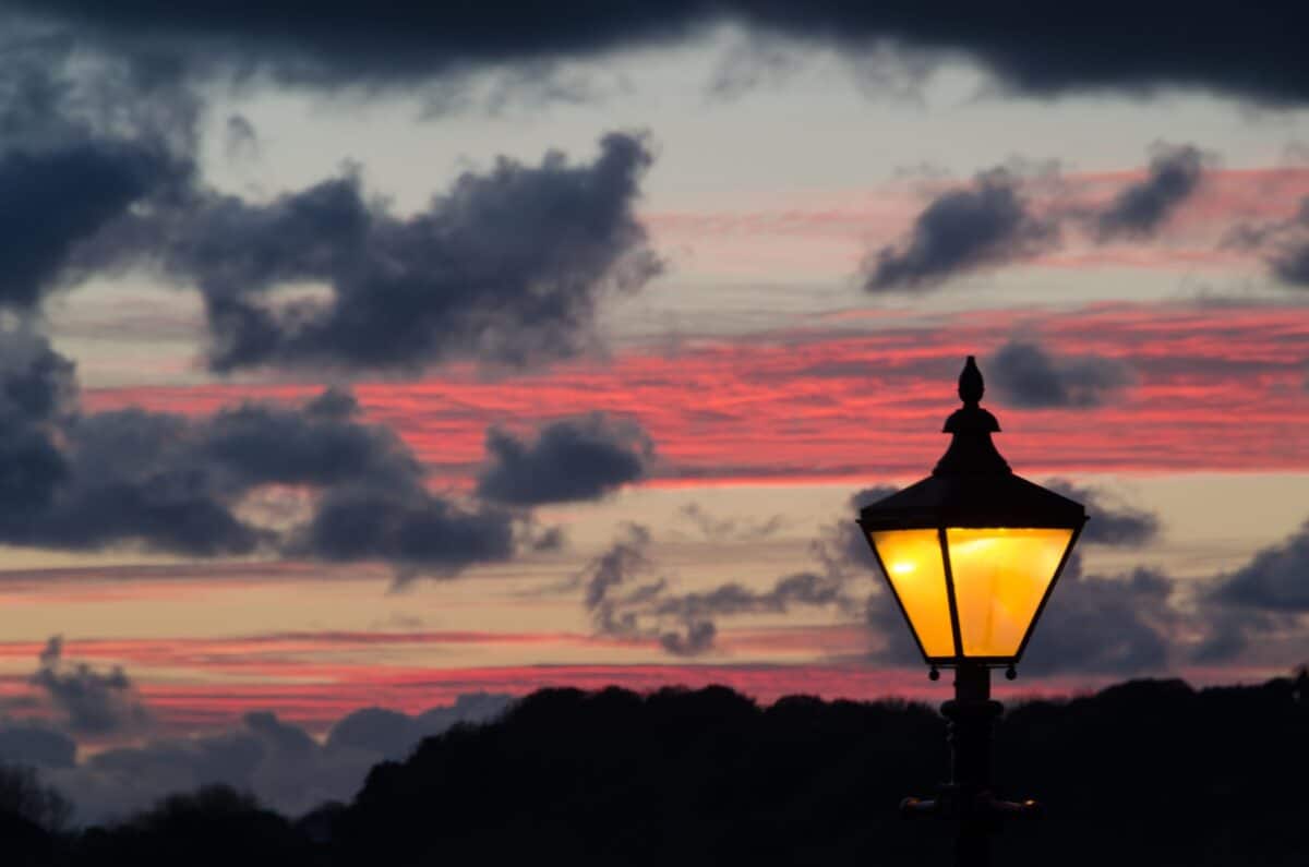 Old street lamp at sunset on Gorey Pier, St. Martin, Jersey