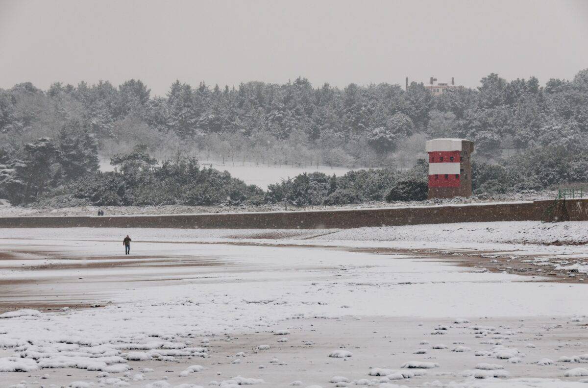 Ouaisné Bay in the snow, St. Brelade, Jersey, Channel Islands