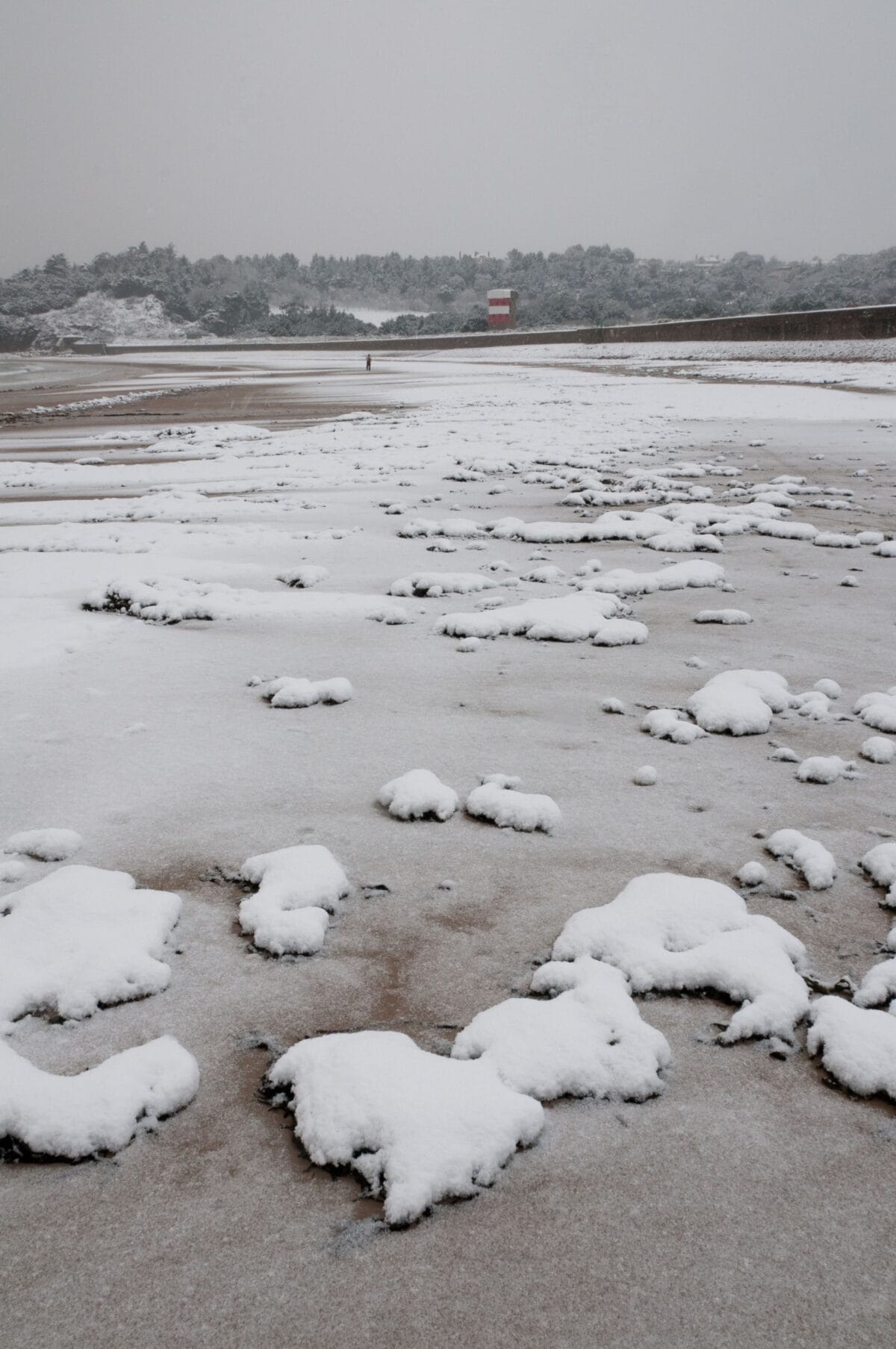 Ouaisné Bay in the snow, St. Brelade, Jersey, Channel Islands