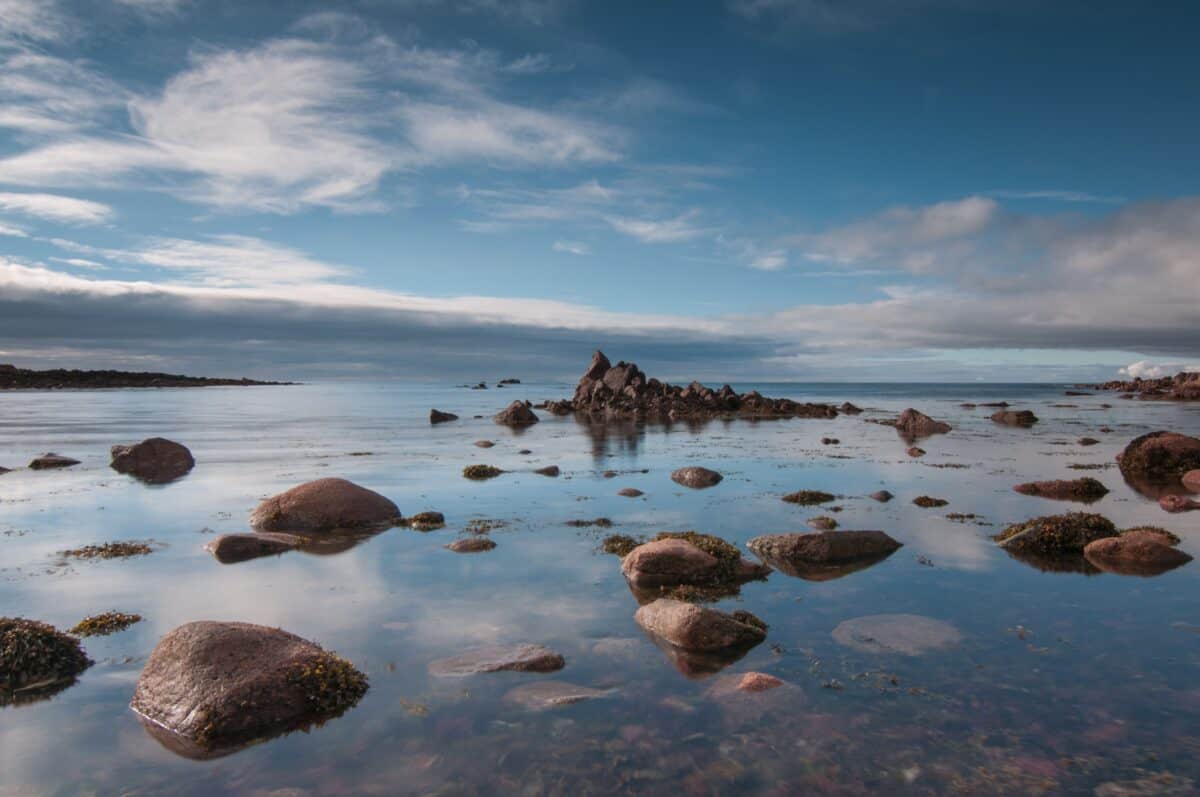 Rocks as the tide comes in at Petit Port, St. Brelade, Jersey
