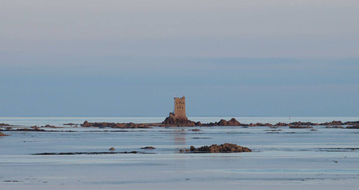 Seascape of Seymour Tower and surrounding rocks on rising tide