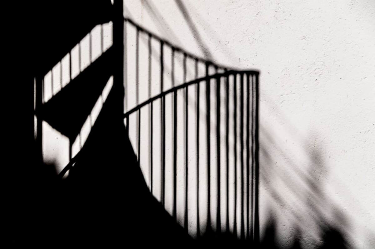 Shadow of a spiral staircase on a wall, St. Brelade, Jersey