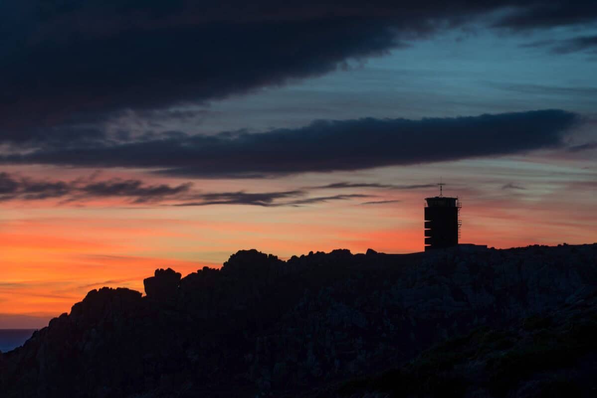 Vibrant sunset, silhouetted Radio Tower and cliffs, La Rosière