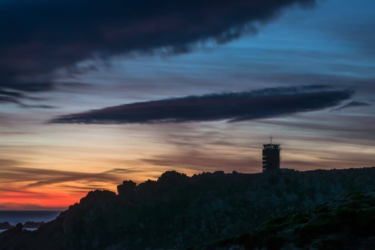 Vibrant sunset, silhouetted Radio Tower and cliffs, La Rosière