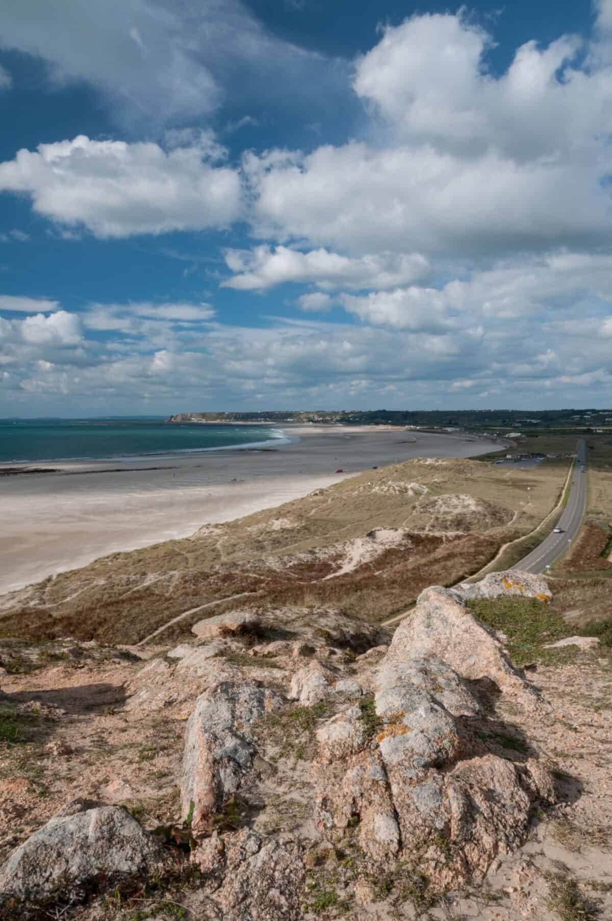 St. Ouen's Bay and fluffy clouds from the headland, La Carrière