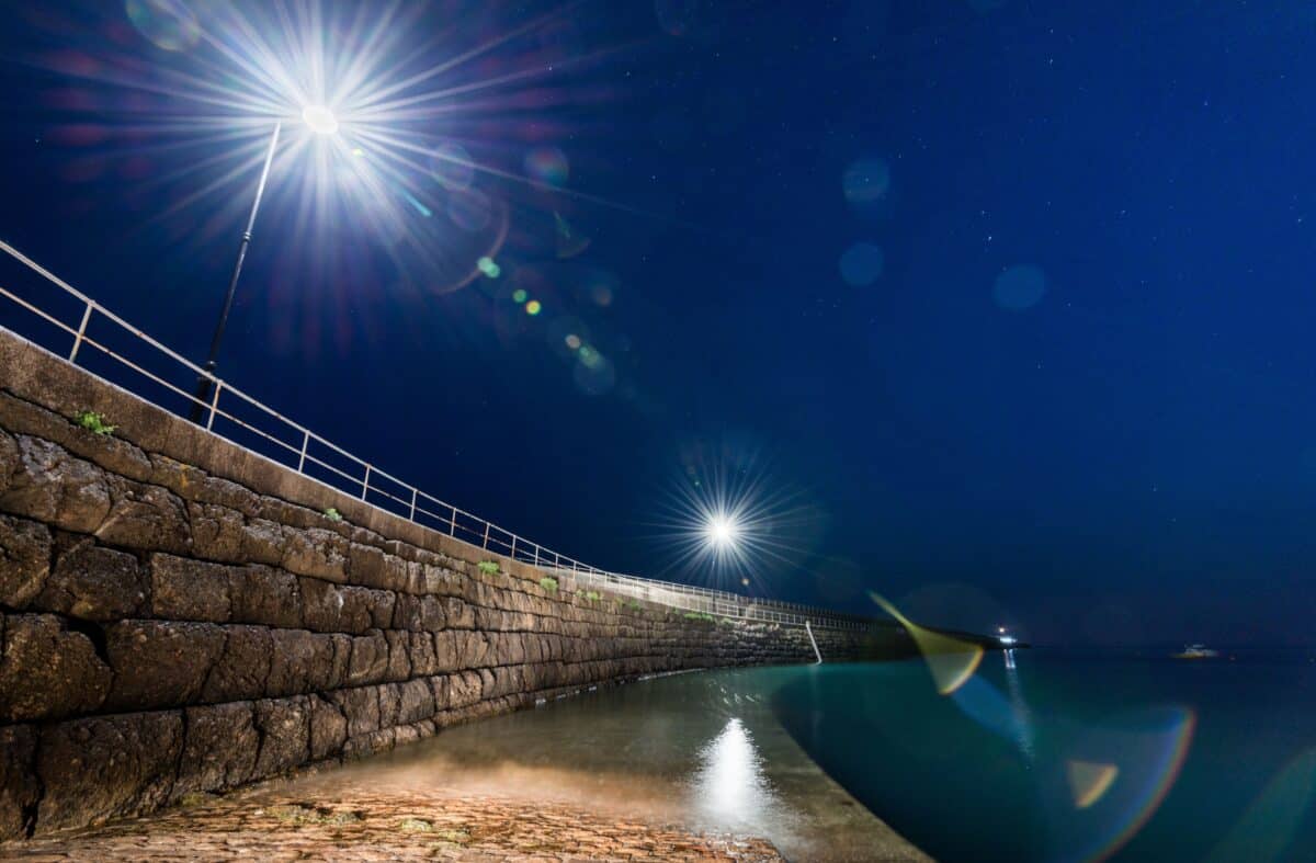 Looking down St. Catherine's Breakwater at night from the slip