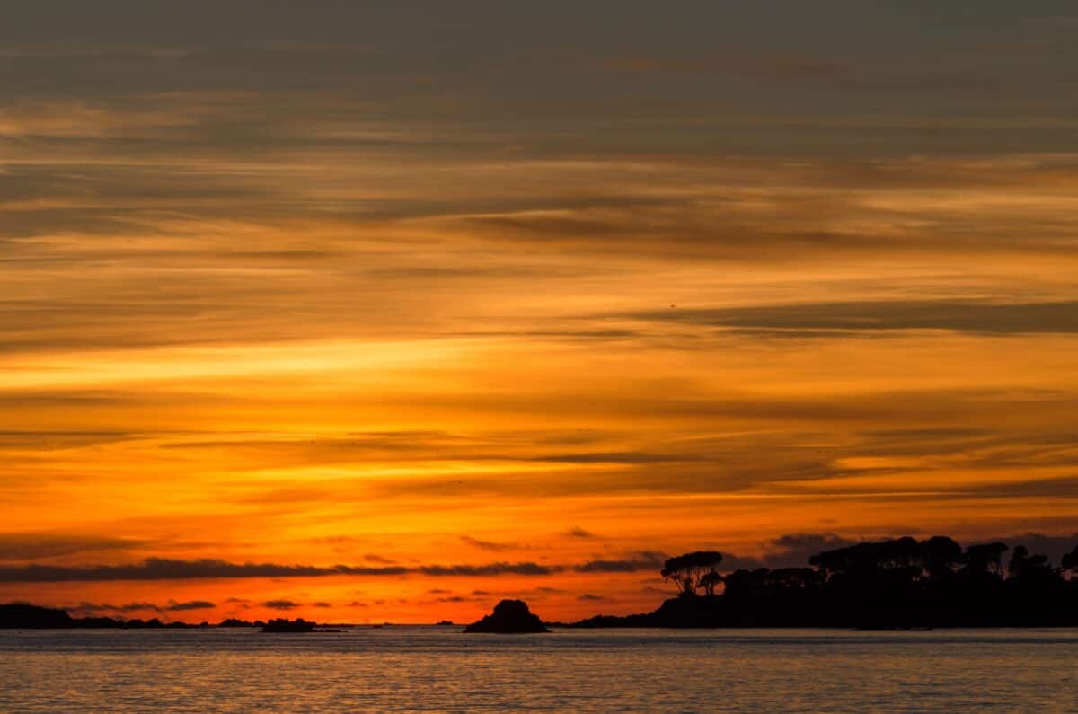 Sunset looking to Green island from La Charrière au Long Slip