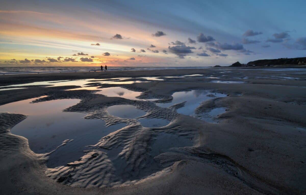 Sunset in the sand puddles at St. Ouen's Bay, St. Ouen, Jersey